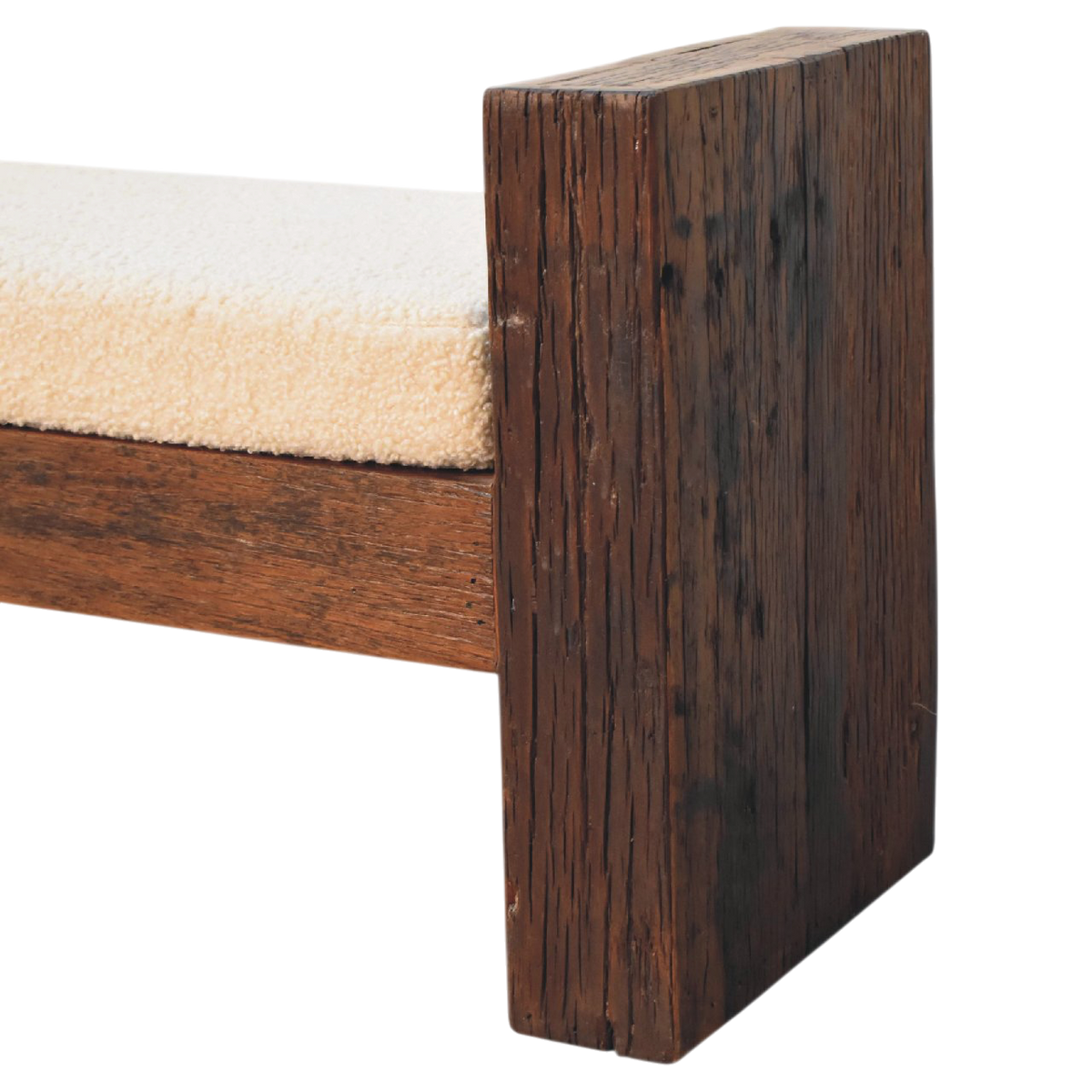 Close view of the edge on the Aldeburgh Reclaimed Bench in Driftwood with Cream Bouclé.