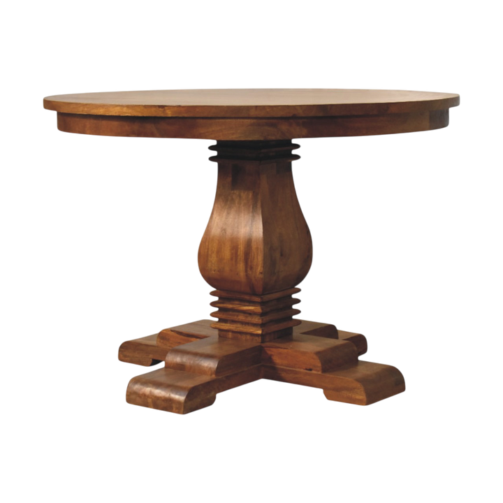 Ashford Round Pedestal Table in Chestnut, front view. A circular chestnut top on a sculpted pedestal base.