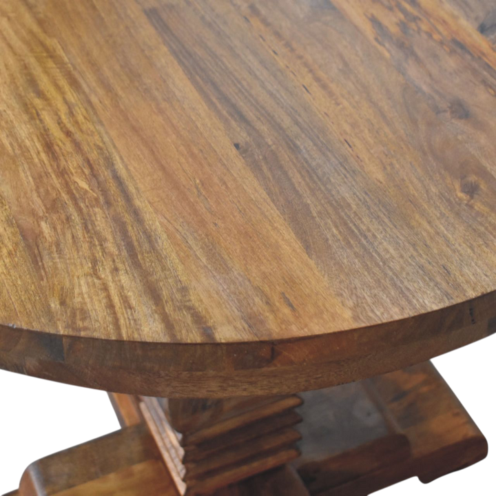 Close view of the grain on the tabletop on the Ashford Round Pedestal Table in Chestnut.