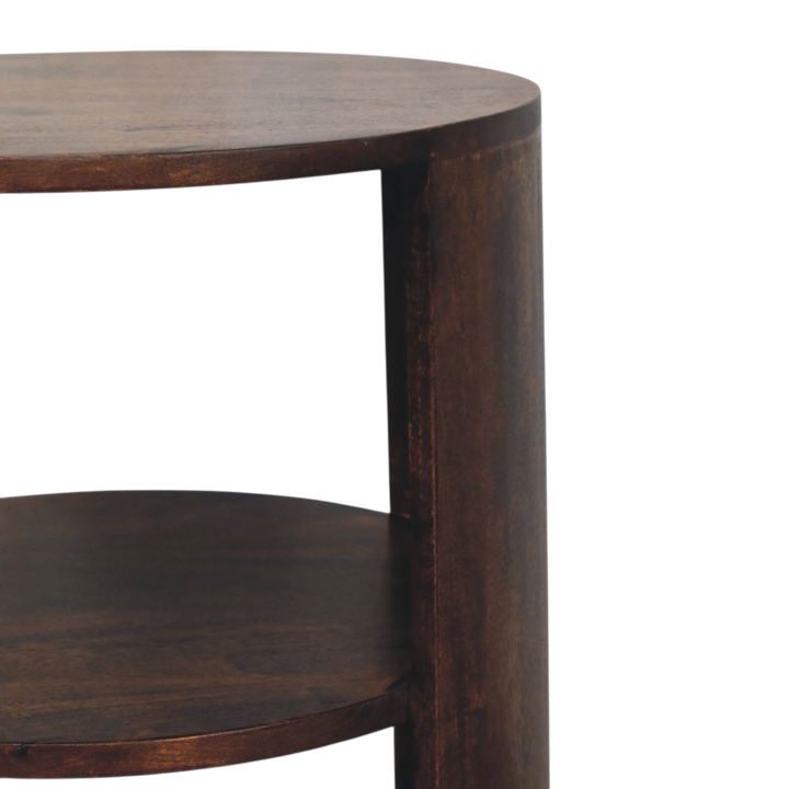 Close view of the shelf on the Ashford Round Side Table in Chestnut.