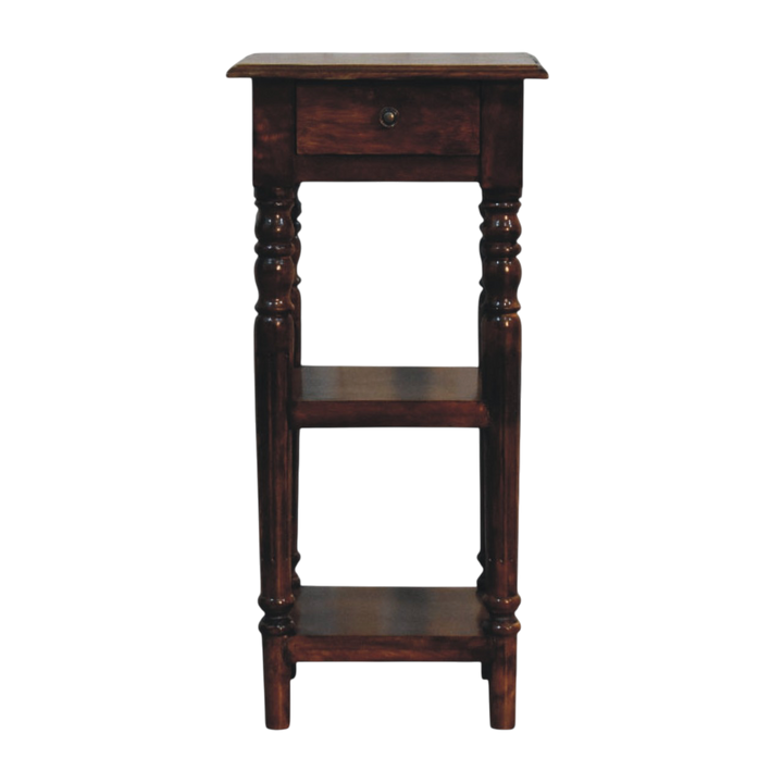 Ashford Tall Side Table in Chestnut, front view. 100% solid hardwood in a chestnut finish, one drawer, small knob, two open shelves, turned legs.