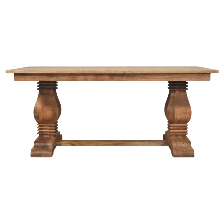 Belvedere Dining Table in Amber, front view. An expansive top on a sculpted double pedestal base.