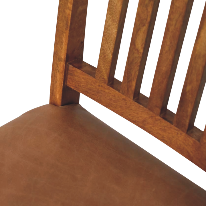 Close view of the seat on the Belvedere Slatted Dining Chair in Amber with Tobacco Leather.