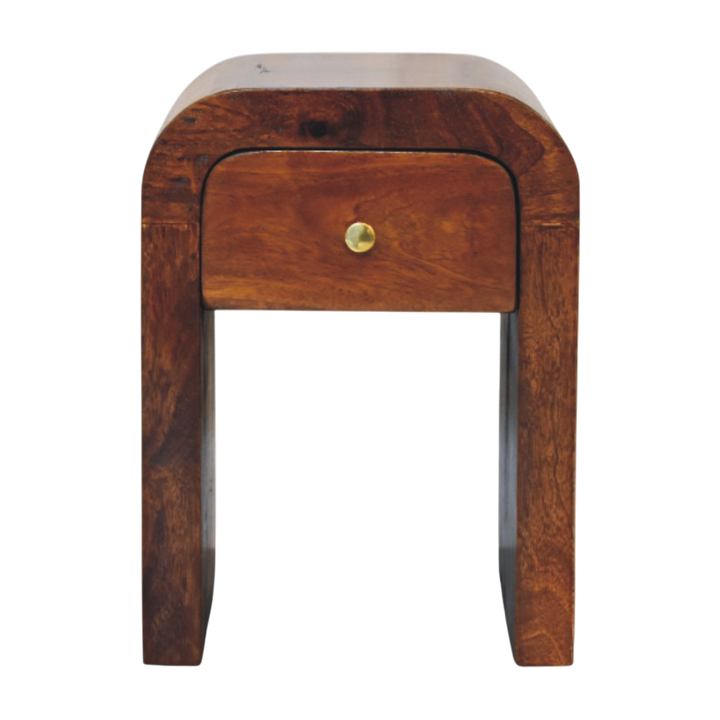 Bibury Mini Bedside Table in Chestnut, front view. 100% solid hardwood in a chestnut finish, one drawer on a brass knob, curved edges.