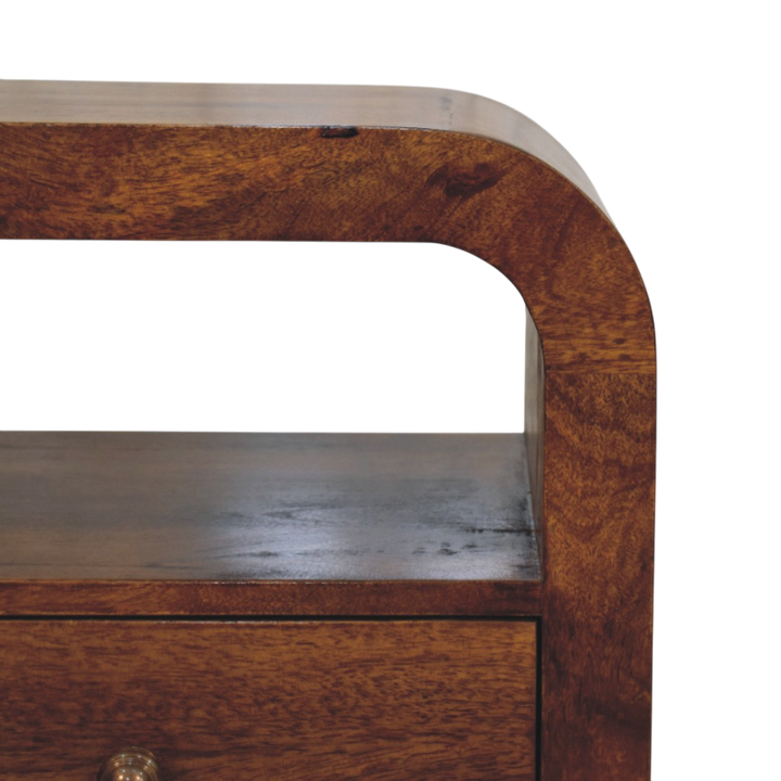 Close view of the shelf on the Bibury Open Bedside Table in Chestnut.