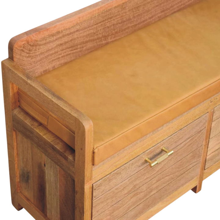 Close view of the seat on the Brighton Storage Bench in Amber with Blonde Saddle.