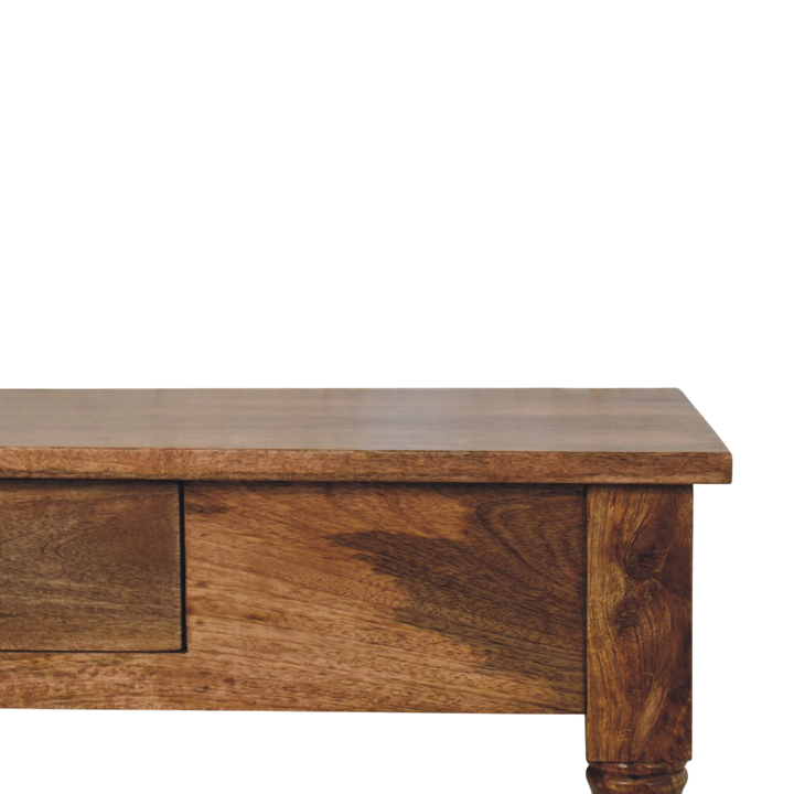 Close view of the apron and turned leg on the Brighton Writing Desk in Amber.