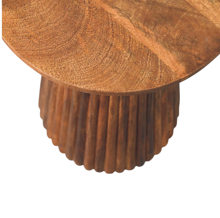 Close view of the top on the Capri Fluted Pedestal Table in Amber.