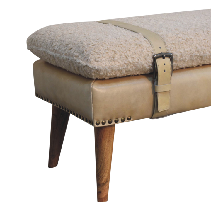 Close view of the strap and buckle on the Chamonix Belted Bench in Cream Bouclé with Almond Leather.