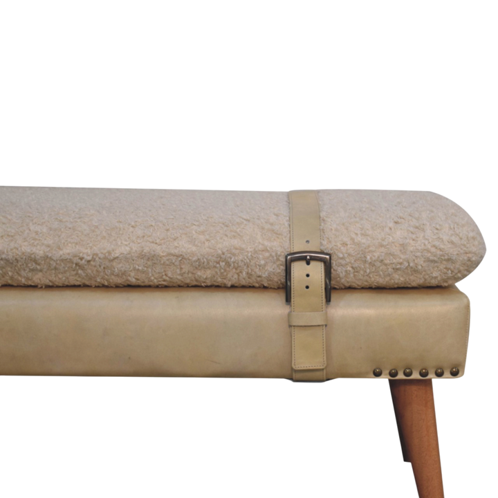 Close view of the stud trim on the Chamonix Belted Bench in Cream Bouclé with Almond Leather.