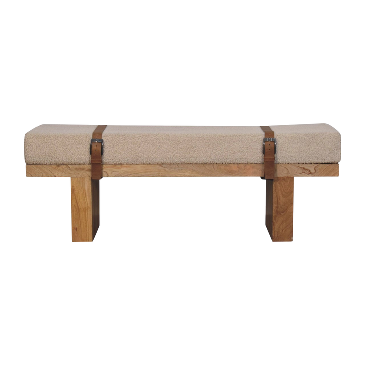 Chamonix Buckled Bench in Cream Bouclé with Tobacco Leather, front view. Cream bouclé in cotton and natural yarn over a 100% solid hardwood frame, tobacco leather buckled straps.