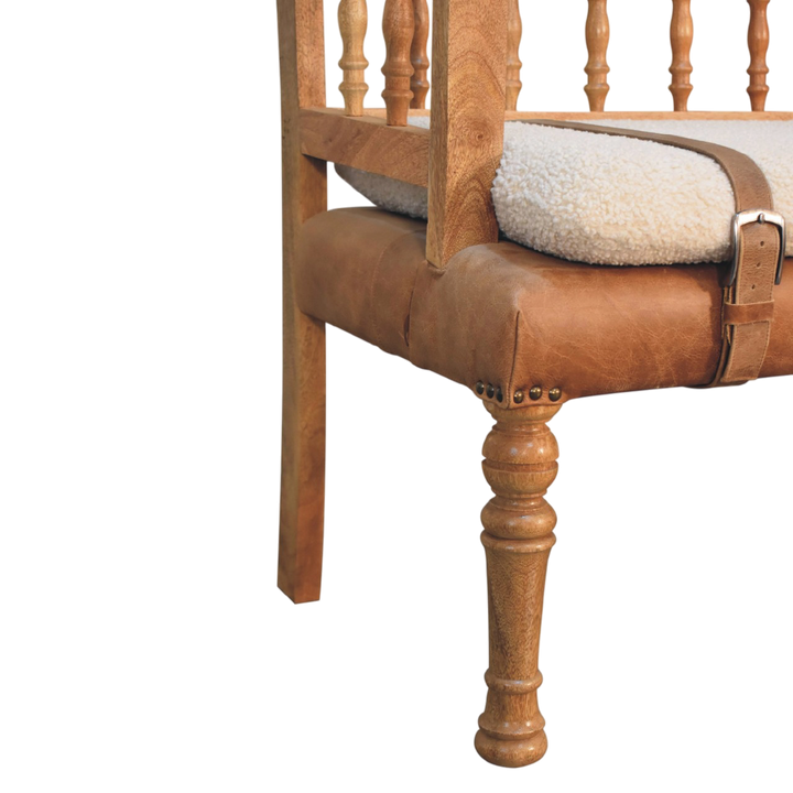 Close view of the legs on the Chamonix Carved Hall Bench in Cream Bouclé with Tobacco Leather.