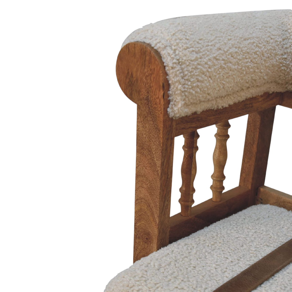 Close view of the arm on the Chamonix Carved Hall Bench in Cream Bouclé with Tobacco Leather.