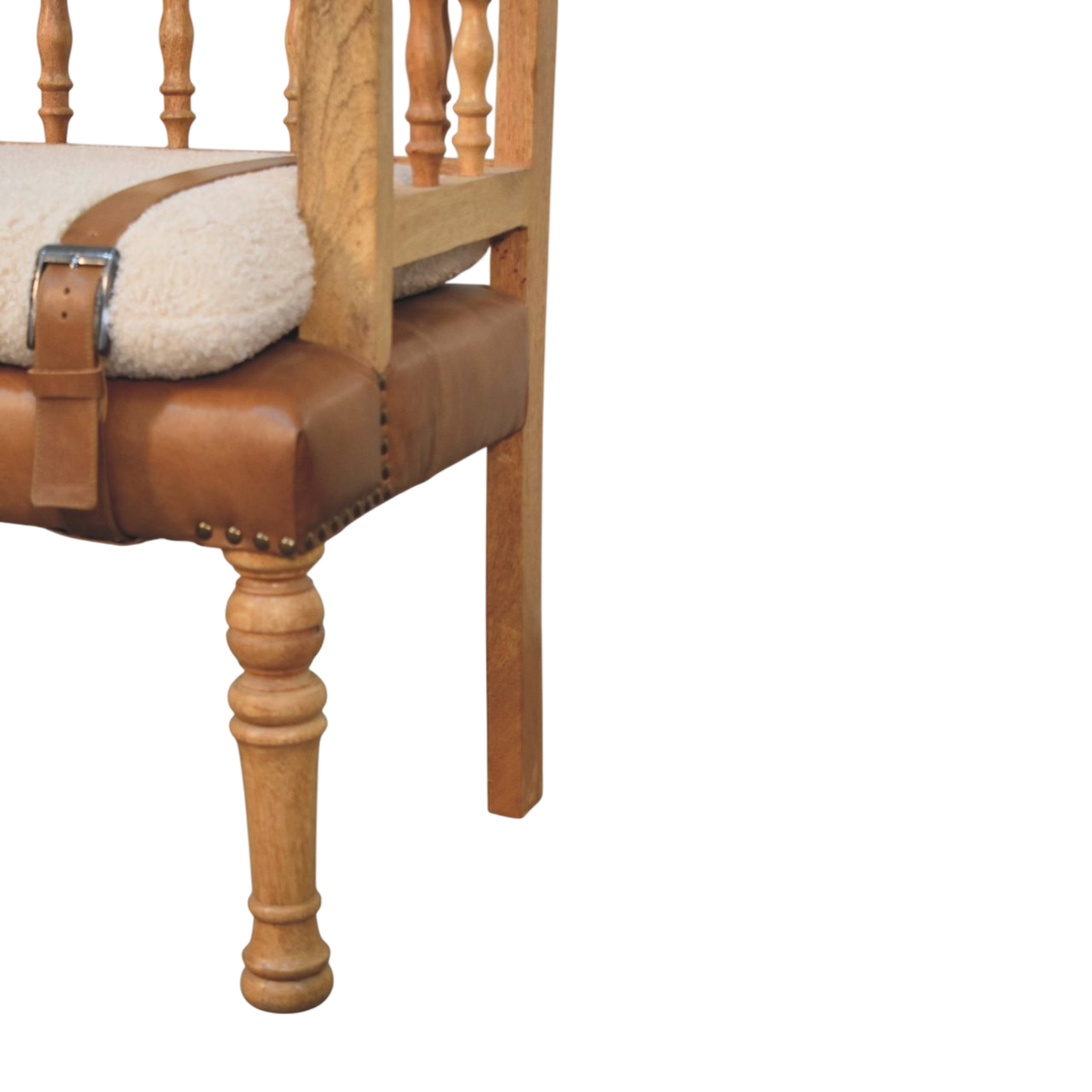 Close view of the strap and buckle on the Chamonix Spindle-Back Bench in Cream Bouclé with Tobacco Leather.