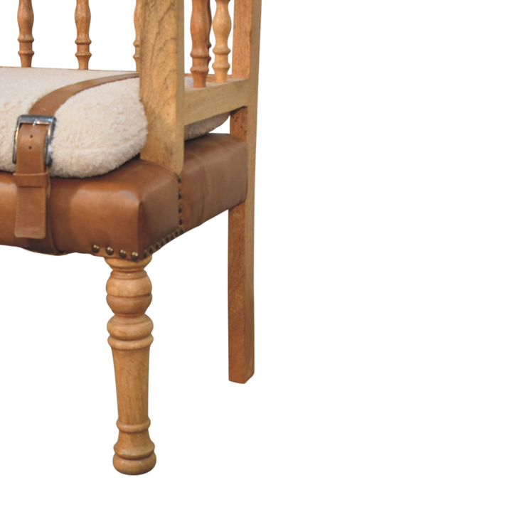 Close view of the strap and buckle on the Chamonix Spindle-Back Bench in Cream Bouclé with Tobacco Leather.