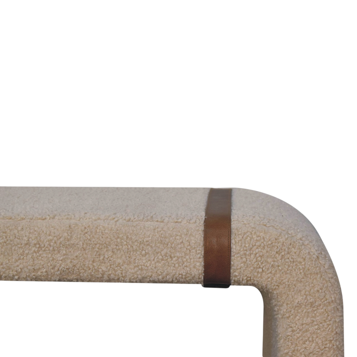 Close view of the strap and buckle on the Chamonix Strap Bench in Cream Bouclé.