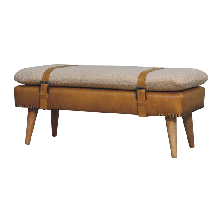 Chamonix Strap Bench in Cream Bouclé with Blonde Saddle, three-quarter view showing the full profile.