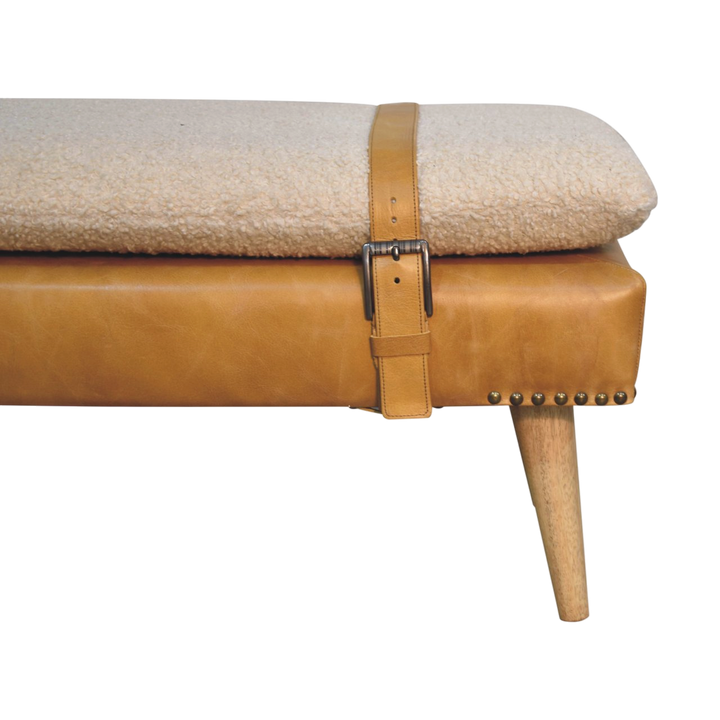 Close view of the strap and buckle on the Chamonix Strap Bench in Cream Bouclé with Blonde Saddle.