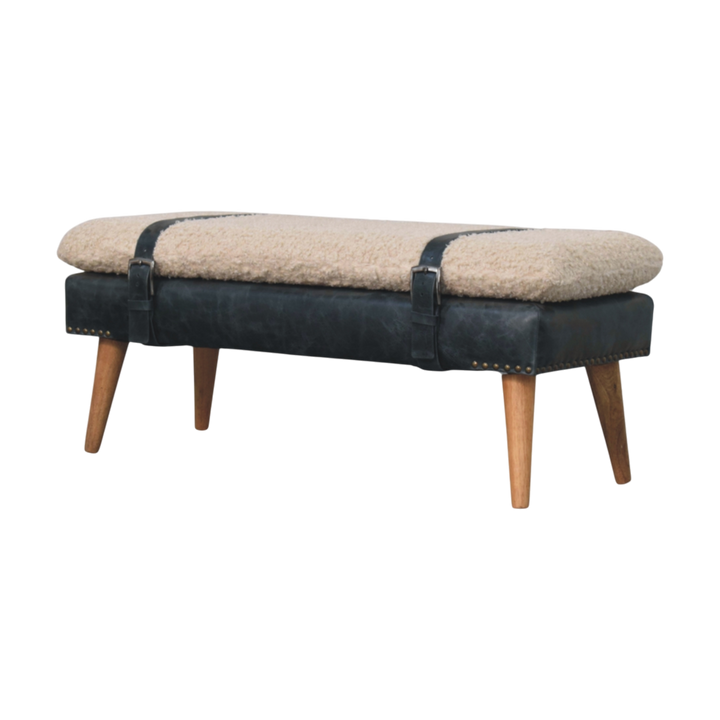 Chamonix Strap Bench in Cream Bouclé with Charcoal Leather, three-quarter view showing the full profile.