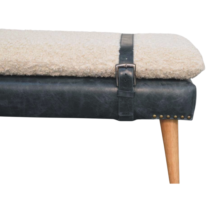 Close view of the strap and buckle on the Chamonix Strap Bench in Cream Bouclé with Charcoal Leather.