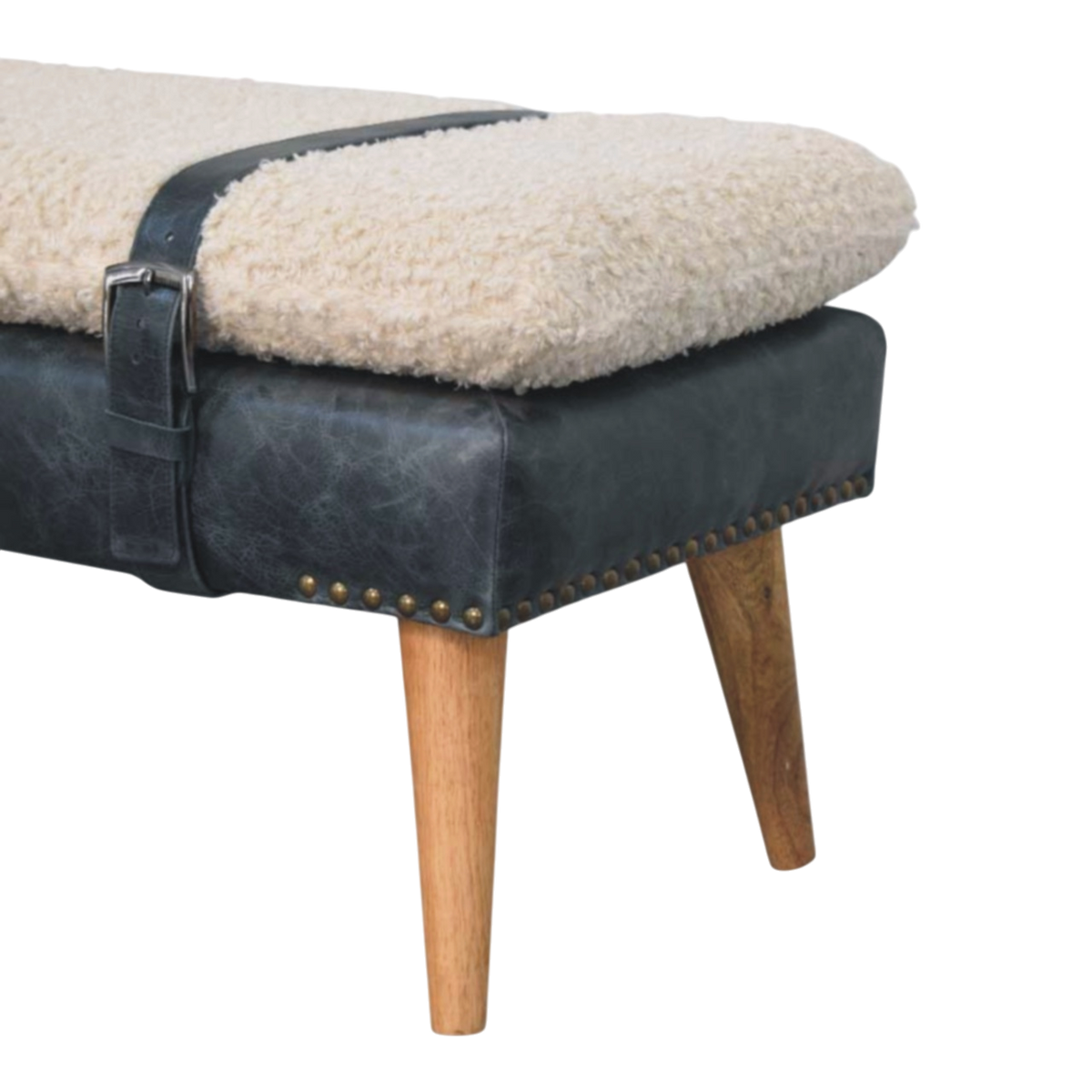 Close view of the turned legs on the Chamonix Strap Bench in Cream Bouclé with Charcoal Leather.