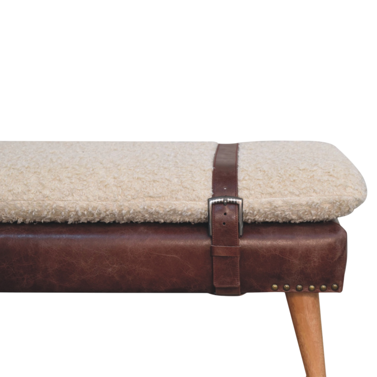 Close view of the strap and buckle on the Chamonix Strap Bench in Cream Bouclé with Cognac Leather.