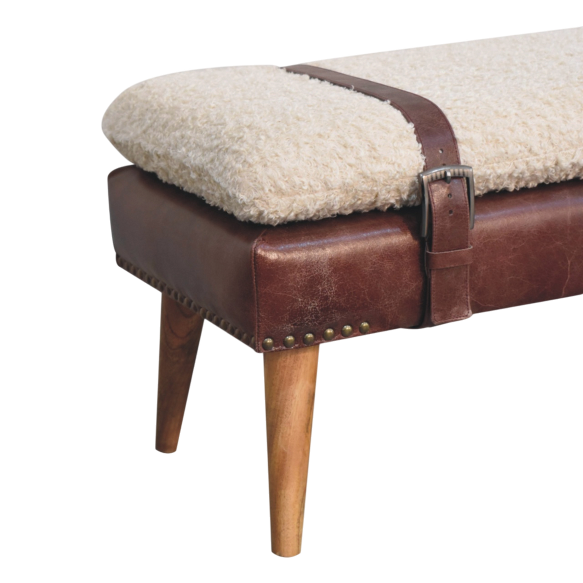 Close view of the turned legs on the Chamonix Strap Bench in Cream Bouclé with Cognac Leather.