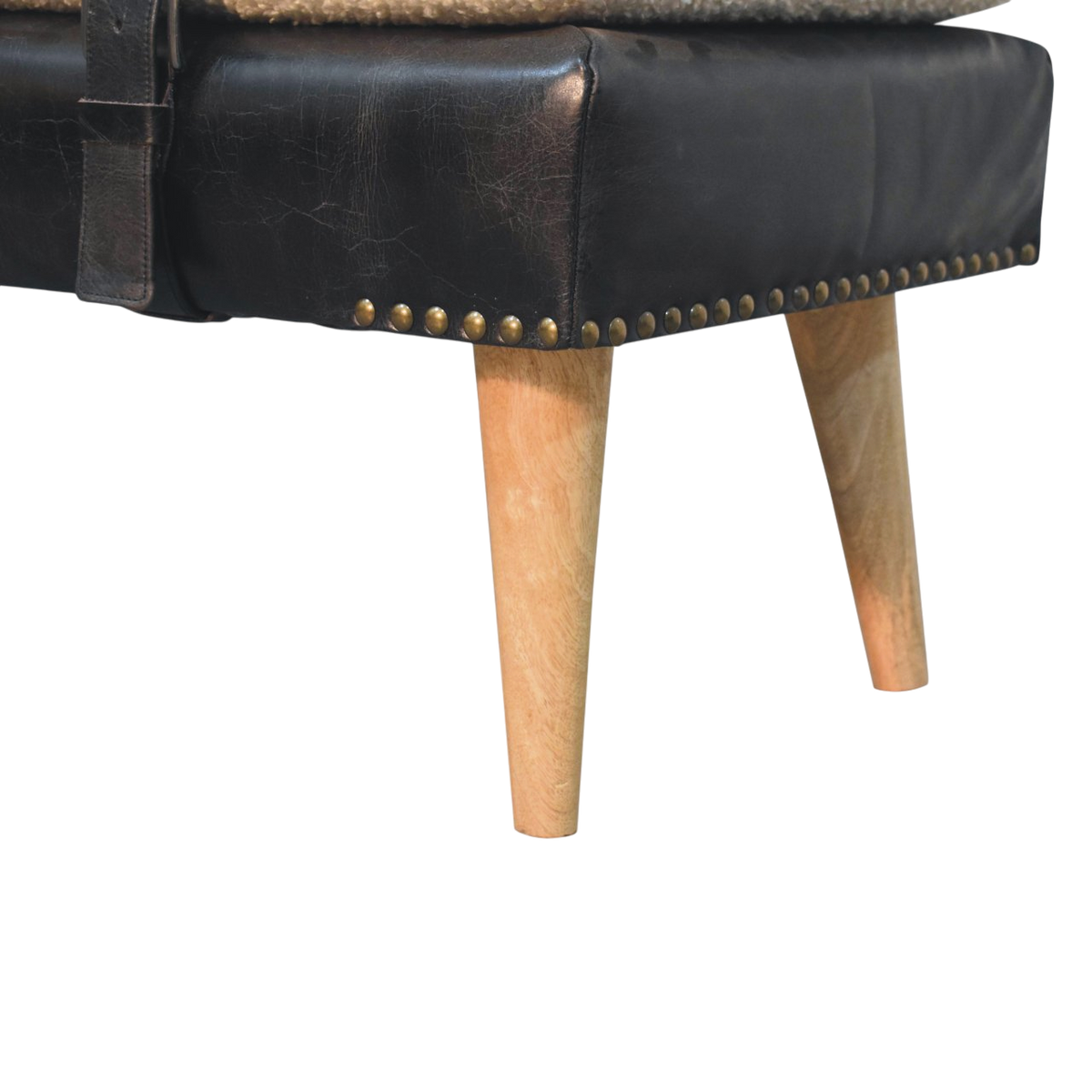 Close view of the turned legs on the Chamonix Strap Bench in Cream Bouclé with Espresso Leather.