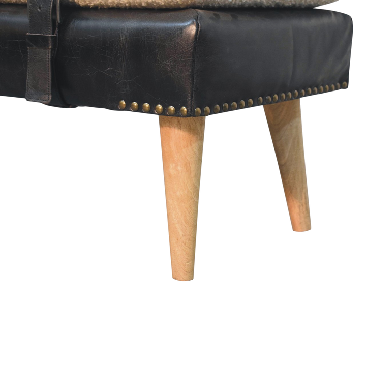 Close view of the turned legs on the Chamonix Strap Bench in Cream Bouclé with Espresso Leather.