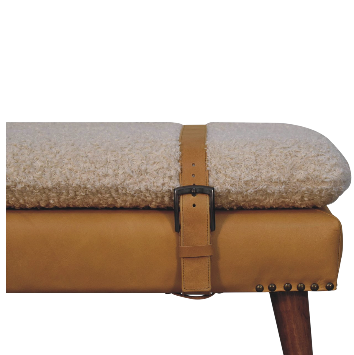 Close view of the strap and buckle on the Chamonix Strap Bench in Cream Bouclé with Tobacco Leather.