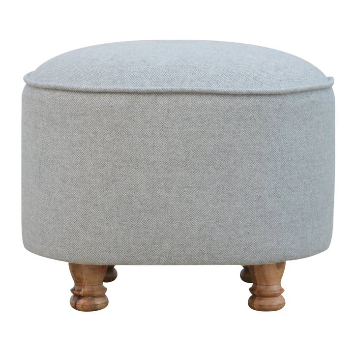 Cheltenham Oval Footstool in Dove Tweed, front view. Dove tweed in wool over a solid hardwood frame, turned bun feet.