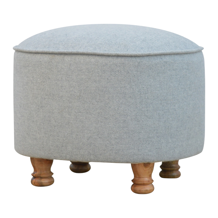 Cheltenham Oval Footstool in Dove Tweed, three-quarter view showing the full profile.
