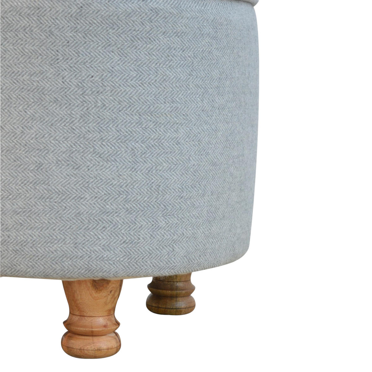 Close view of the feet on the Cheltenham Oval Footstool in Dove Tweed.