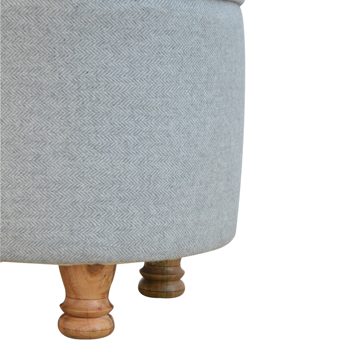 Close view of the feet on the Cheltenham Oval Footstool in Dove Tweed.