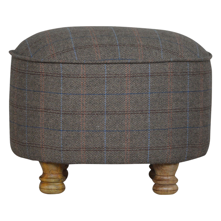Cheltenham Oval Footstool in Heritage Tweed, front view. Heritage tweed in mixed wool over a solid hardwood frame, turned bun feet.