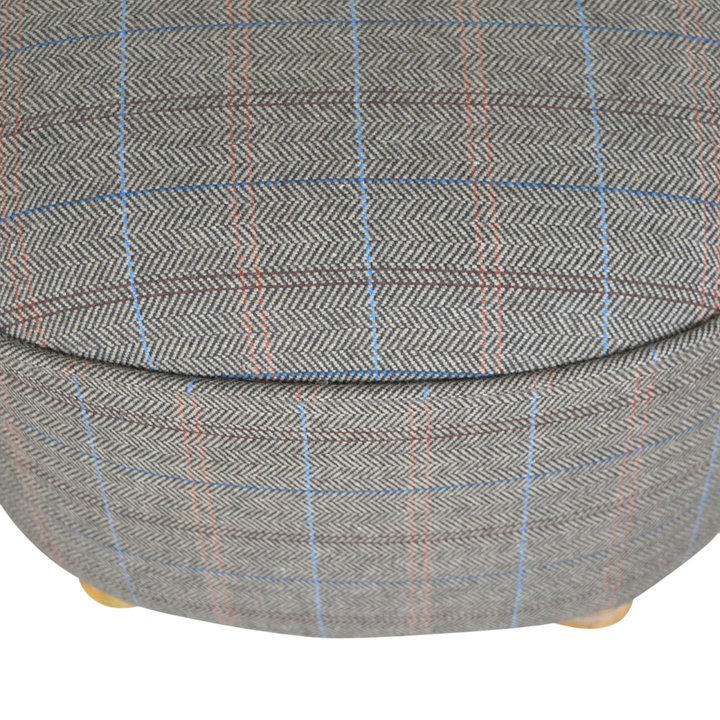 Close view of the seat on the Cheltenham Oval Footstool in Heritage Tweed.