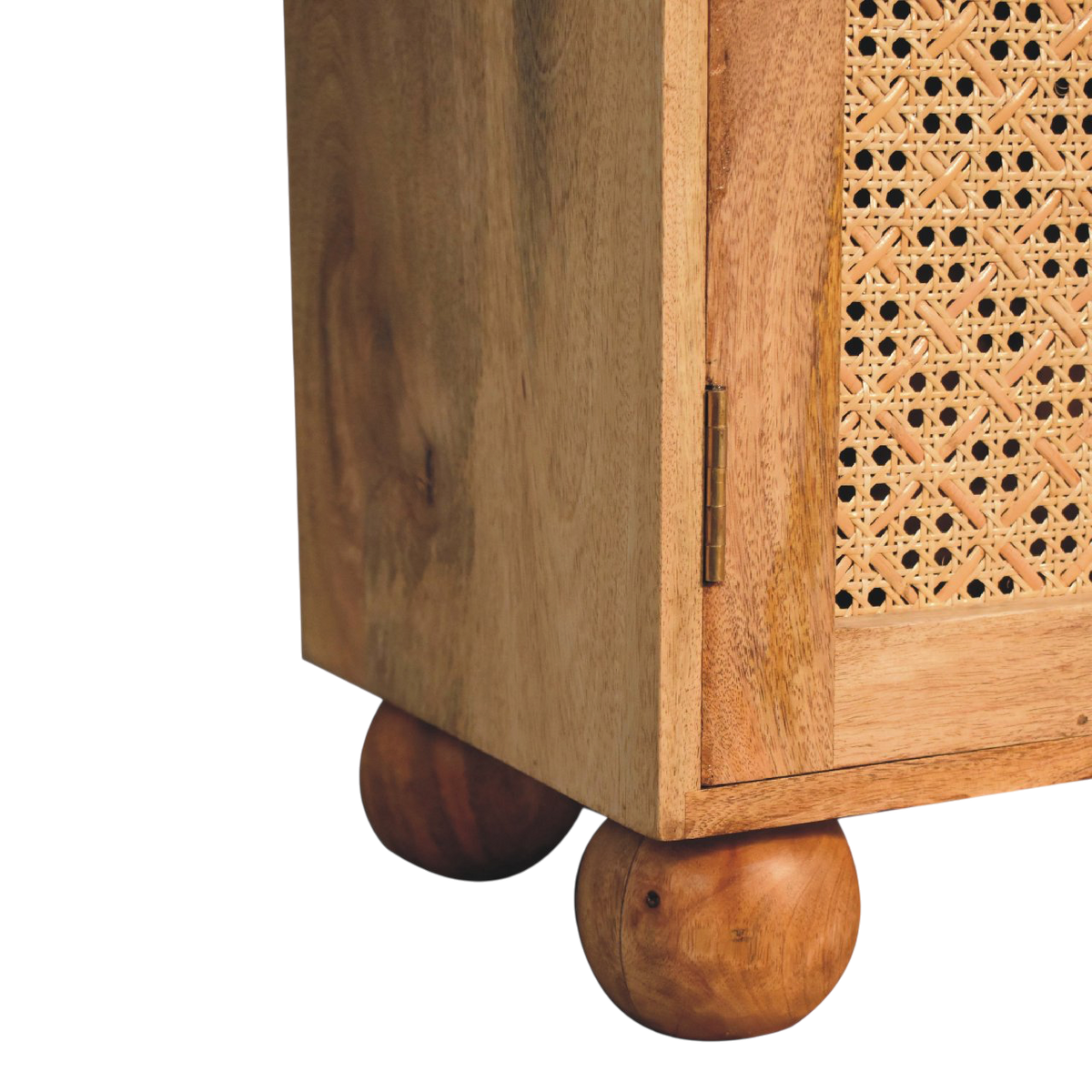 Close view of the feet on the Comporta Arched Cane Cabinet in Amber with Natural Rattan.