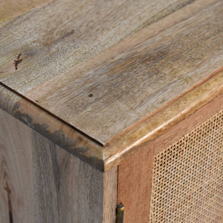 Close view of the rattan wrap on the base on the Comporta Cane Cabinet in Amber.