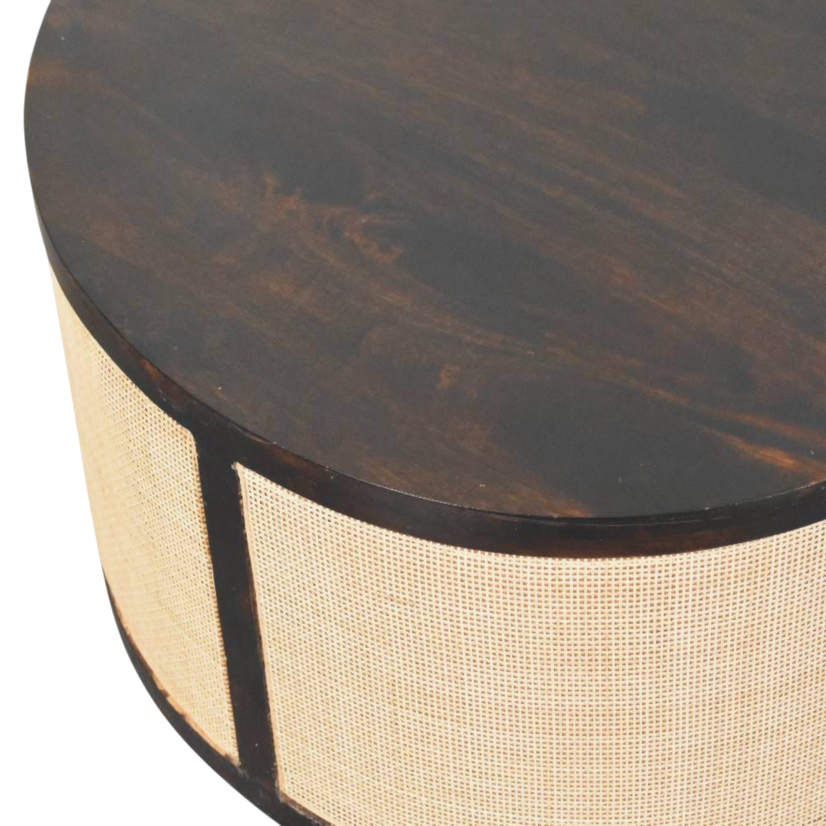 Close view of the edge profile and speckled surface on the Comporta Drum Coffee Table in Espresso and Natural Rattan.
