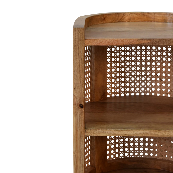 Close view of the shelf on the Comporta Mini Open Bedside Table in Amber with Natural Rattan.