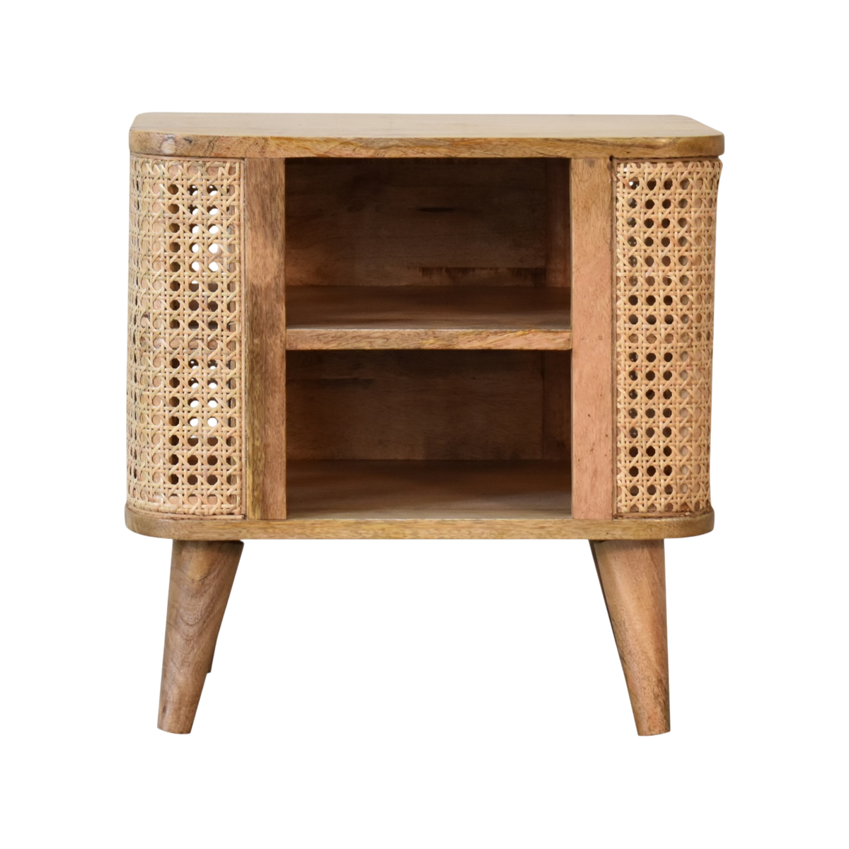 Comporta Open Bedside Table in Amber with Natural Rattan, front view. 100% solid hardwood in a warm amber finish, woven rattan panels, open body, two small drawers, tapered legs.