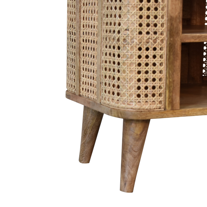 Close view of the legs on the Comporta Open Bedside Table in Amber with Natural Rattan.