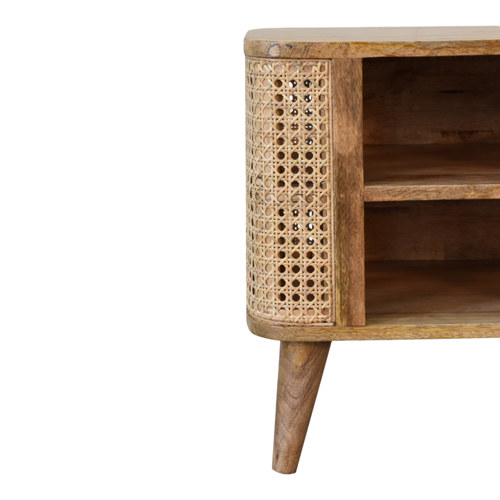 Close view of the shelf on the Comporta Open Bedside Table in Amber with Natural Rattan.