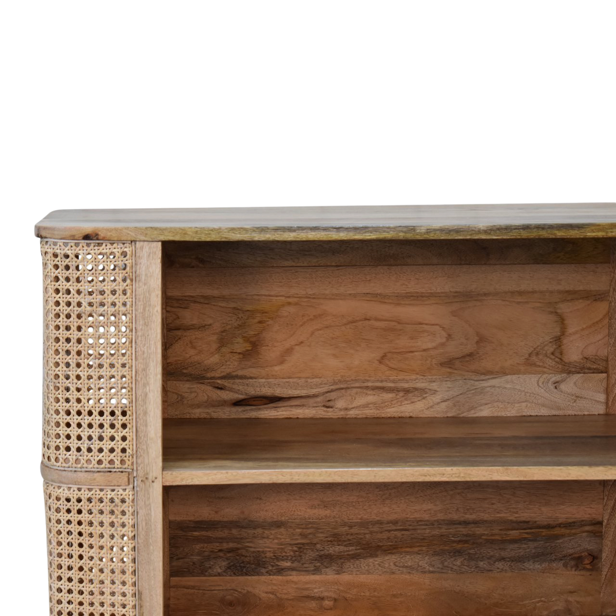 Close view of the shelf on the Comporta Open Cabinet in Amber with Natural Rattan.