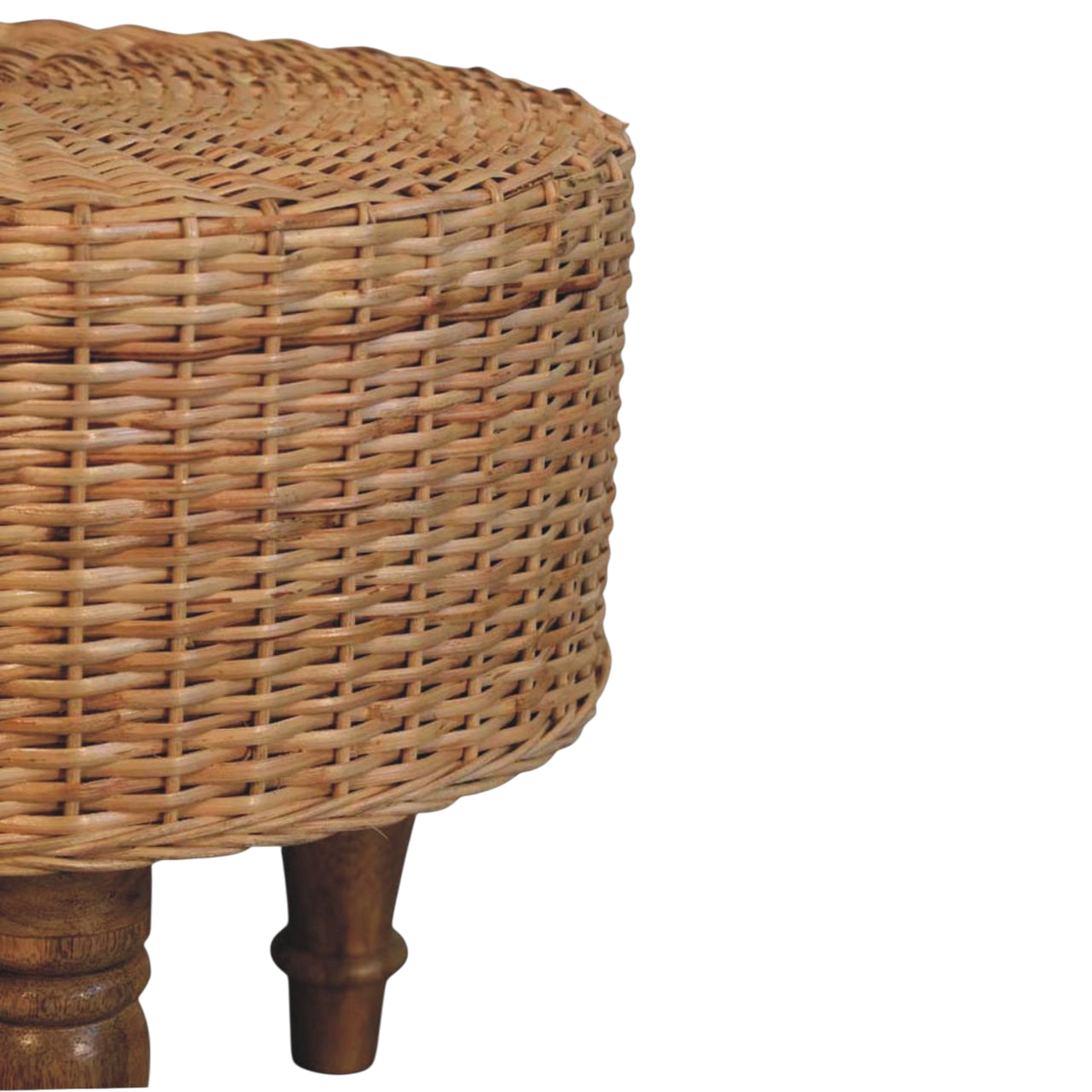 Close view of the legs on the Comporta Round Woven Stool in Amber.