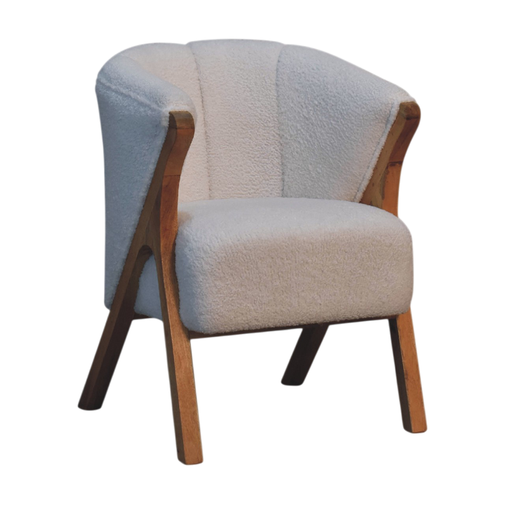 Delano Bouclé Lounge Chair in Chestnut and Alabaster Bouclé, three-quarter view showing the full profile.