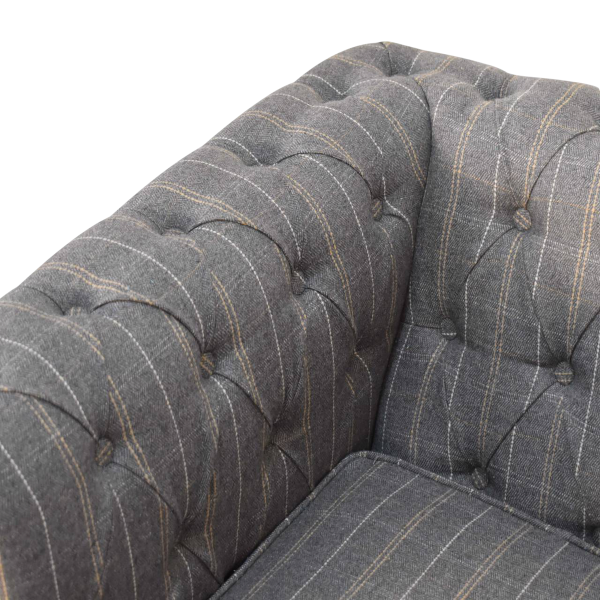 Close view of the buttoning on the Fitzroy Chesterfield Armchair in Dove Tweed.