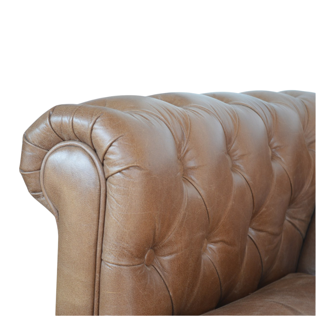 Close view of the rolled leather arm and buttoning on the Fitzroy Chesterfield Loveseat.