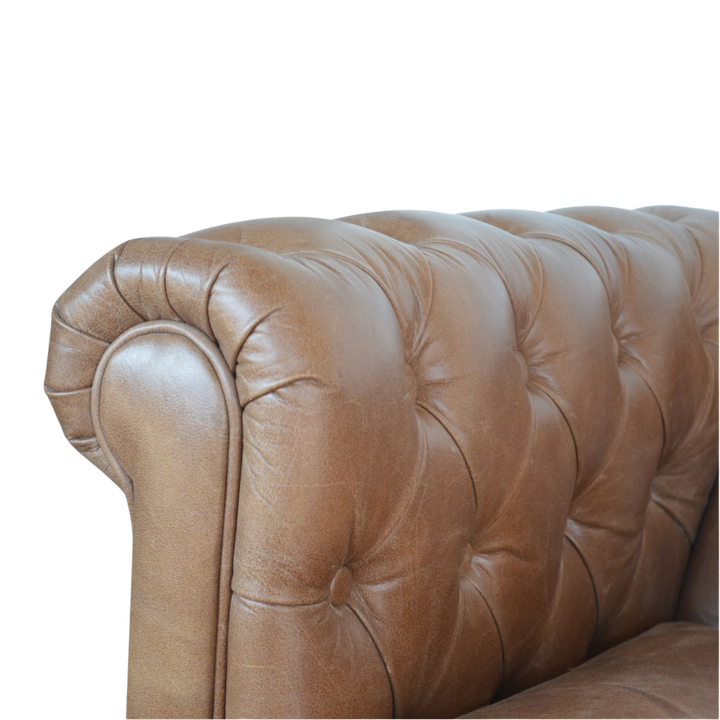 Close view of the rolled leather arm and buttoning on the Fitzroy Chesterfield Loveseat.