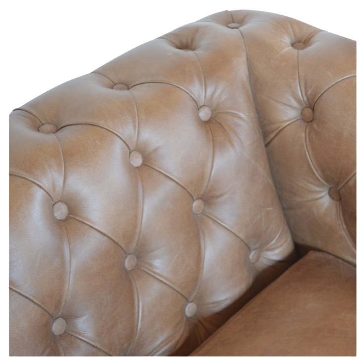 Close view of the seat cushion and leather grain on the Fitzroy Chesterfield Loveseat.
